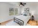 Inviting bedroom with a black bed frame, white linens, side tables and nature view window at 327 Berry St, Rock Hill, SC 29732