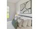 Bedroom with an abstract art and a black metal bed frame with white linen pillows at 327 Berry St, Rock Hill, SC 29732