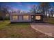 Evening shot of a cozy home with warm interior lighting and a welcoming front porch, creating an inviting atmosphere at 327 Berry St, Rock Hill, SC 29732