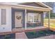 Inviting front porch with seating and a decorative wreath on the front door for a warm and welcoming entrance at 327 Berry St, Rock Hill, SC 29732