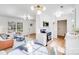 Bright, open-concept living space featuring modern stainless steel appliances and a cozy seating area at 327 Berry St, Rock Hill, SC 29732