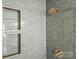 Shower featuring green subway tiles and built in shower niche with gold trim at 327 Berry St, Rock Hill, SC 29732