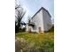 View of the backyard and the back of the home with a small porch at 421 Rocky Brook Dr, Shelby, NC 28150