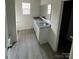 Bathroom featuring double sinks, granite countertops and a window at 421 Rocky Brook Dr, Shelby, NC 28150