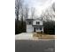Charming two-story home featuring a covered porch, attached garage, and landscaped yard at 421 Rocky Brook Dr, Shelby, NC 28150