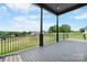 Spacious back deck with wrought iron railing overlooking a lush green landscape at 4227 Holly Ne Cir, Conover, NC 28613