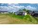 Expansive backyard featuring a well-maintained lawn and a charming white brick home at 4227 Holly Ne Cir, Conover, NC 28613