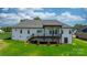 Stunning backyard featuring a covered deck with wrought iron railing and lush lawn at 4227 Holly Ne Cir, Conover, NC 28613