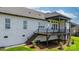 Exterior view of a home featuring a covered deck with stairs and wrought iron railing at 4227 Holly Ne Cir, Conover, NC 28613