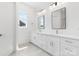 Stylish bathroom featuring dual sinks, granite countertops, modern fixtures, and tiled floors at 4227 Holly Ne Cir, Conover, NC 28613