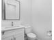 Bright bathroom featuring sleek cabinets, granite countertop and a stainless steel faucet at 4227 Holly Ne Cir, Conover, NC 28613