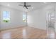 Spacious bedroom features two windows, a ceiling fan, hardwood floors, and white walls at 4227 Holly Ne Cir, Conover, NC 28613