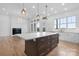 Open concept kitchen features large island with seating, modern lighting, and stainless steel appliances at 4227 Holly Ne Cir, Conover, NC 28613