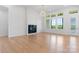 Bright living room with large windows, a modern fireplace, and elegant lighting at 4227 Holly Ne Cir, Conover, NC 28613