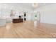 Open living room with hardwood floors and an open floor plan looking to the kitchen at 4227 Holly Ne Cir, Conover, NC 28613