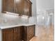This home features a beautiful butler's pantry with custom cabinets and elegant countertops at 4227 Holly Ne Cir, Conover, NC 28613