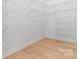 Spacious walk-in closet with custom shelving and ample storage space, perfect for organization at 4227 Holly Ne Cir, Conover, NC 28613