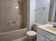 Cozy bathroom featuring tub-shower combo, toilet, and vanity with a light colored countertop at 446 Windsor Ln, Statesville, NC 28677
