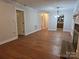 Spacious living room featuring hardwood floors, neutral walls, and a fireplace at 446 Windsor Ln, Statesville, NC 28677