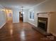 Inviting living room offers fireplace, hardwood floors and natural light at 446 Windsor Ln, Statesville, NC 28677