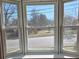 A bay window offers an exterior view of the neighborhood street and surrounding greenery at 446 Windsor Ln, Statesville, NC 28677