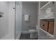 Bathroom with white tile shower, modern vanity, and stylish finishes at 447 Beacon Nw St, Concord, NC 28027