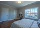 Bright bedroom offers hardwood floors, two closets, and a large window at 447 Beacon Nw St, Concord, NC 28027