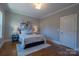 Bedroom featuring a decorative wall art, plush rug and two bedside tables with lamps at 447 Beacon Nw St, Concord, NC 28027