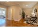 Hallway features hardwood floors, neutral paint, with doorways leading to the office and bedroom at 447 Beacon Nw St, Concord, NC 28027