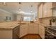 Well-lit kitchen showcasing granite counters, a breakfast bar, and stainless steel sink at 447 Beacon Nw St, Concord, NC 28027
