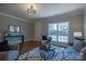 Bright, open living room with hardwood floors, a large window, and views of the exterior at 447 Beacon Nw St, Concord, NC 28027