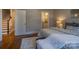 Comfortable main bedroom with attached bathroom and hardwood floors at 447 Beacon Nw St, Concord, NC 28027