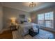Cozy main bedroom with stylish furnishings, a large window, and soft, neutral tones at 447 Beacon Nw St, Concord, NC 28027