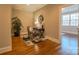 Home office area featuring hardwood floors, a desk, chair, and ample natural light from the window at 447 Beacon Nw St, Concord, NC 28027