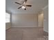 Spacious bedroom featuring neutral walls, carpet, and ceiling fan at 5017 Willing Ct # 124, Fort Mill, SC 29707