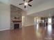 Inviting living room with hardwood floors, stone fireplace, and seamless flow to the kitchen at 5017 Willing Ct # 124, Fort Mill, SC 29707