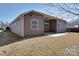 Backyard featuring vinyl siding, grass, concrete patio, and manicured lawn at 5017 Willing Ct # 124, Indian Land, SC 29707