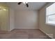 Neutral bedroom with carpet, ceiling fan with lights, and window with blinds at 5017 Willing Ct # 124, Indian Land, SC 29707