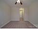 Neutral bedroom with carpet, ceiling fan with lights, and access to the closet at 5017 Willing Ct # 124, Indian Land, SC 29707