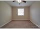 Neutral bedroom with carpet, ceiling fan with lights, and window with blinds at 5017 Willing Ct # 124, Indian Land, SC 29707