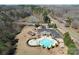 Aerial view of the community pool area with a clover shape and surrounding amenities at 5017 Willing Ct # 124, Indian Land, SC 29707