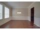 Formal dining room features hardwood floors, wainscoting, a chandelier, and abundant natural light at 5017 Willing Ct # 124, Indian Land, SC 29707