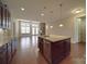 Open-concept kitchen featuring a large island, stainless steel appliances, and seamless flow into the living area at 5017 Willing Ct # 124, Indian Land, SC 29707