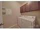 Laundry room with cabinets, front-loading washer and dryer at 5017 Willing Ct # 124, Indian Land, SC 29707