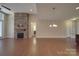 Inviting living room with stone fireplace and hardwood floors at 5017 Willing Ct # 124, Indian Land, SC 29707