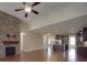 Open-concept living space featuring a stone fireplace, kitchen and hardwood floors at 5017 Willing Ct # 124, Indian Land, SC 29707
