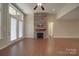 Cozy living room with stone fireplace and hardwood floors at 5017 Willing Ct # 124, Indian Land, SC 29707