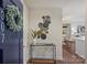 Inviting condo entryway featuring stylish decor, a modern console table, and a blue entry door with wreath at 718 W Trade St # 307, Charlotte, NC 28202