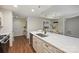 Kitchen with stainless steel appliances, white countertops with view into the dining area at 718 W Trade St # 307, Charlotte, NC 28202