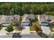 Aerial view of a well-maintained suburban home with manicured lawns and mature trees at 8107 Crater Lake Dr, Indian Land, SC 29707
